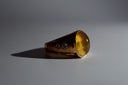 Gold ring with embedded diamonds on a gray background